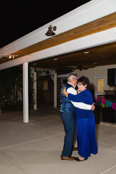 Mother son dance at The Farmhouse at Schnepf Farms wedding reception by Arizona wedding photographer PMA Photography.