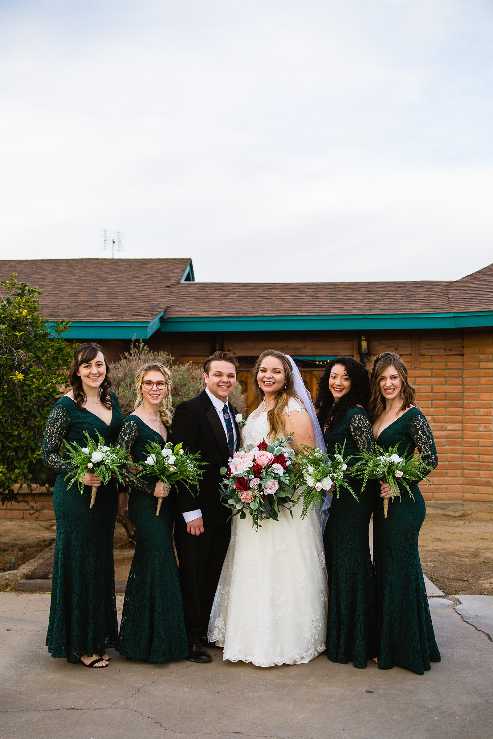 Bride and mixed gender bridal party together at a Backyard wedding by Arizona wedding photographer PMA Photography.