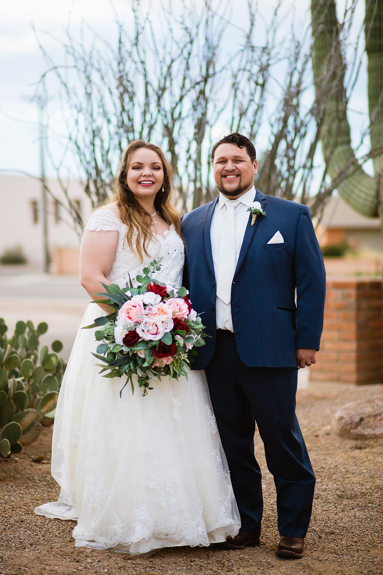 Bride and Groom pose during their Backyard wedding by Arizona wedding photographer PMA Photography.