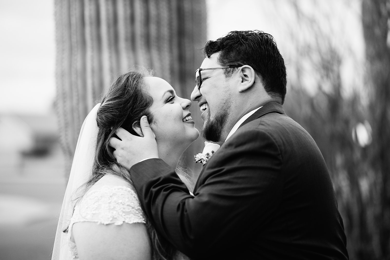 Bride and Groom share an intimate moment during their Backyard wedding by Casa Grande wedding photographer PMA Photography.