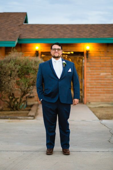 Groom's Navy suit for his backyard wedding by PMA Photography.