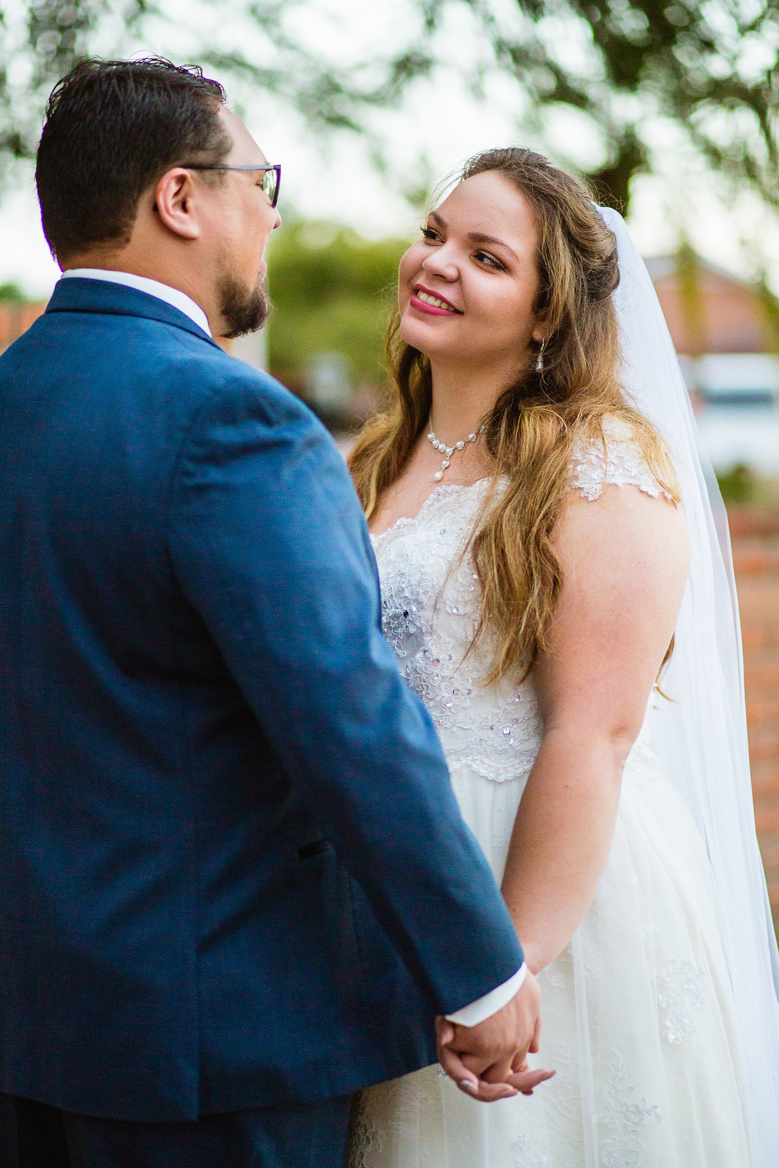 Bride and Groom share an intimate moment at their Backyard wedding by Arizona wedding photographer PMA Photography.