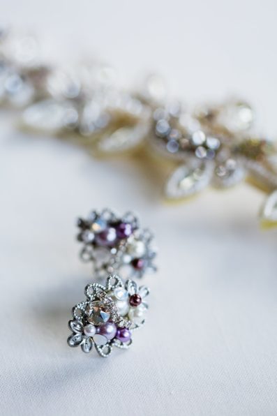 Purple and pearl bridal earrings by PMA Photography.