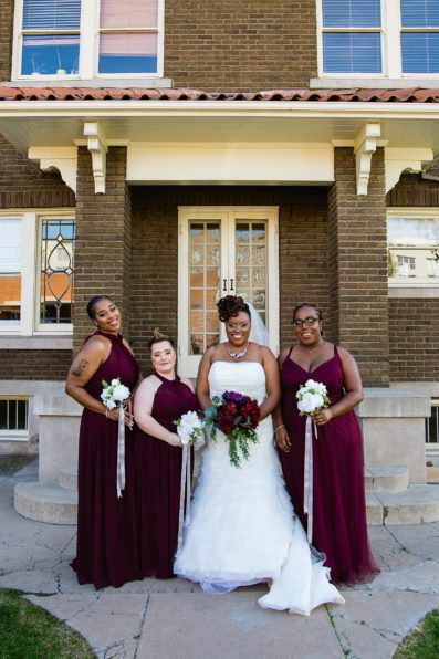 Bride and bridesmaids together at a Ellis-Shackelford House wedding by Arizona wedding photographer PMA Photography.