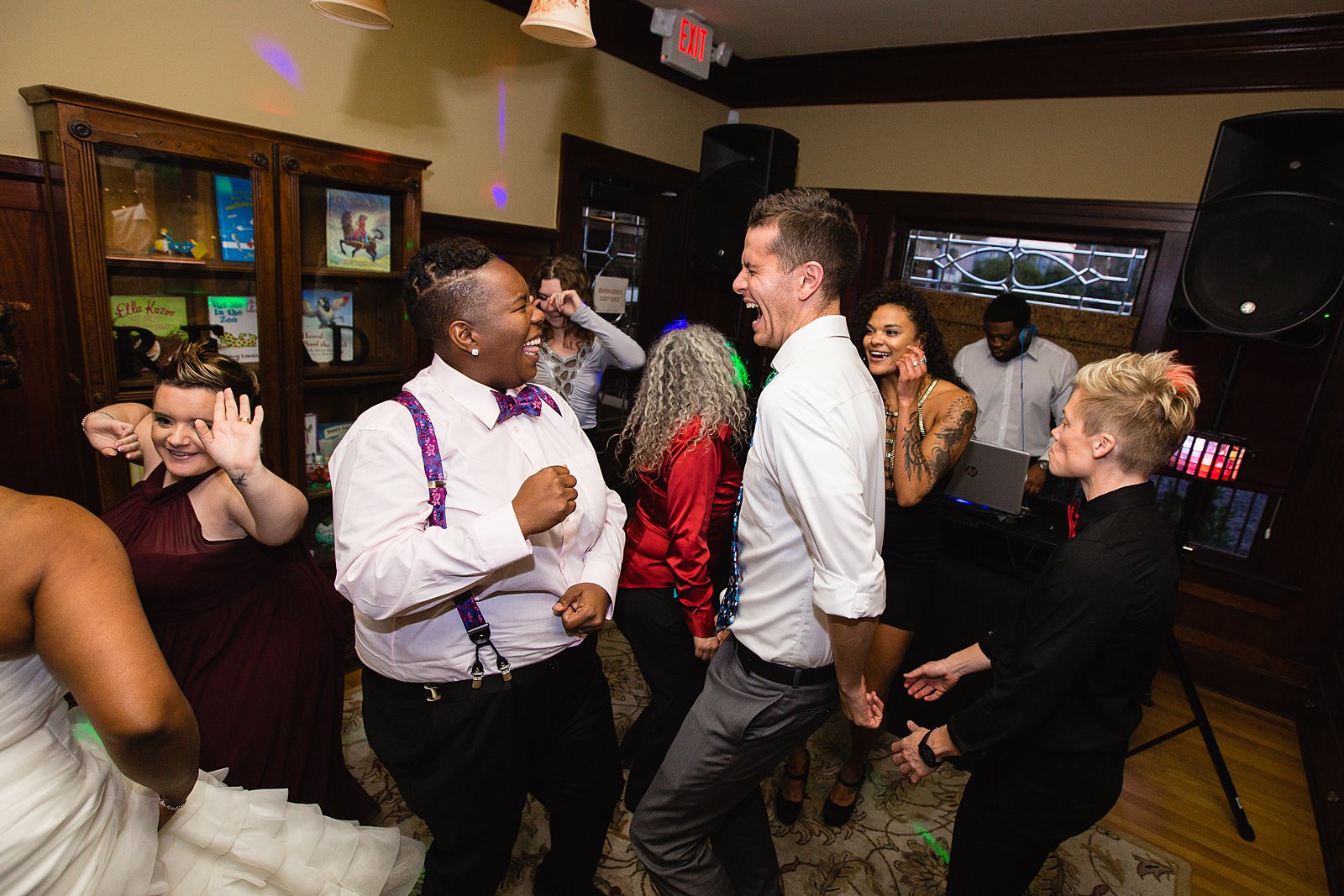 Bride dancing with guests at Ellis-Shackelford House wedding reception by Phoenix wedding photographer PMA Photography
