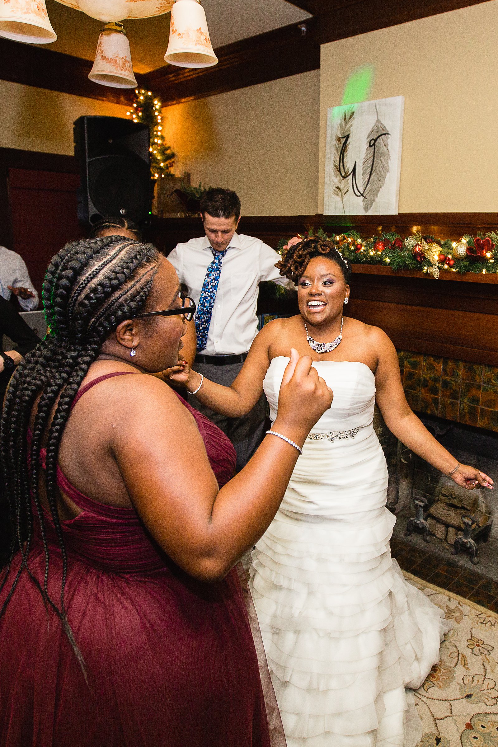 Bride dancing with guests at Ellis-Shackelford House wedding reception by Phoenix wedding photographer PMA Photography