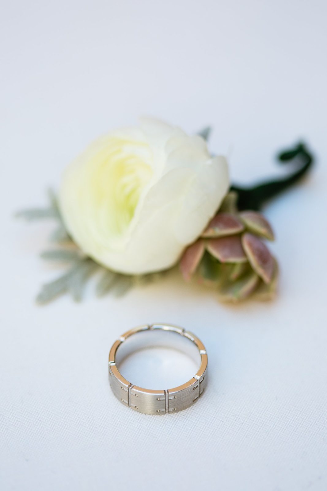 Groom's unique wedding band by PMA Photography.