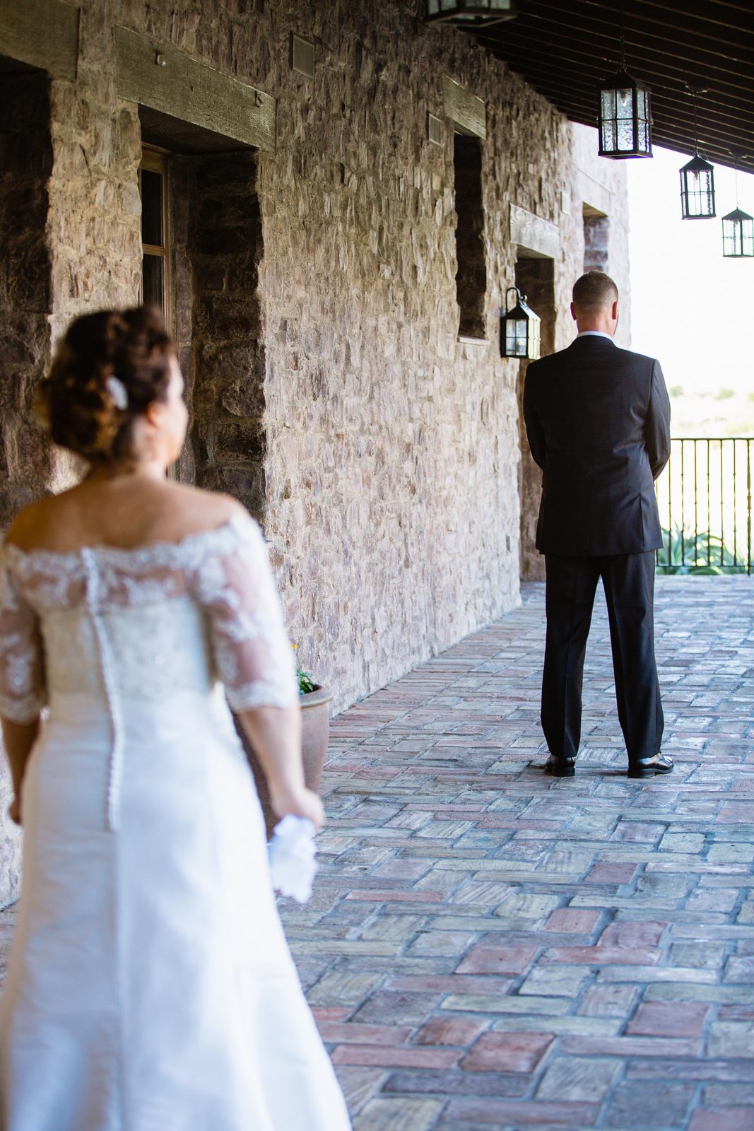 Bride and groom's first look at Superstition Mountain Clubhouse by Arizona wedding photographer PMA Photography.