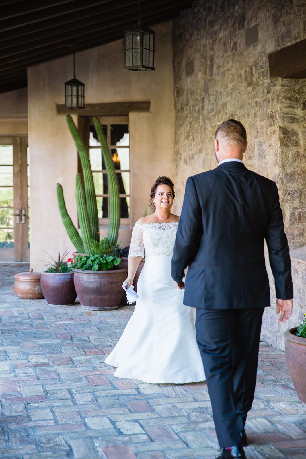 Bride and groom's first look at Superstition Mountain Clubhouse by Arizona wedding photographer PMA Photography.