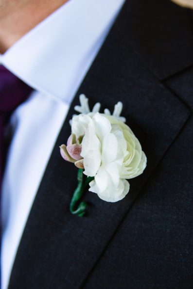 Groom's white and purple succulent boutonniere by PMA Photography.
