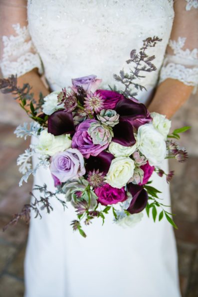 Bride's purple and succulent bouquet by PMA Photography.