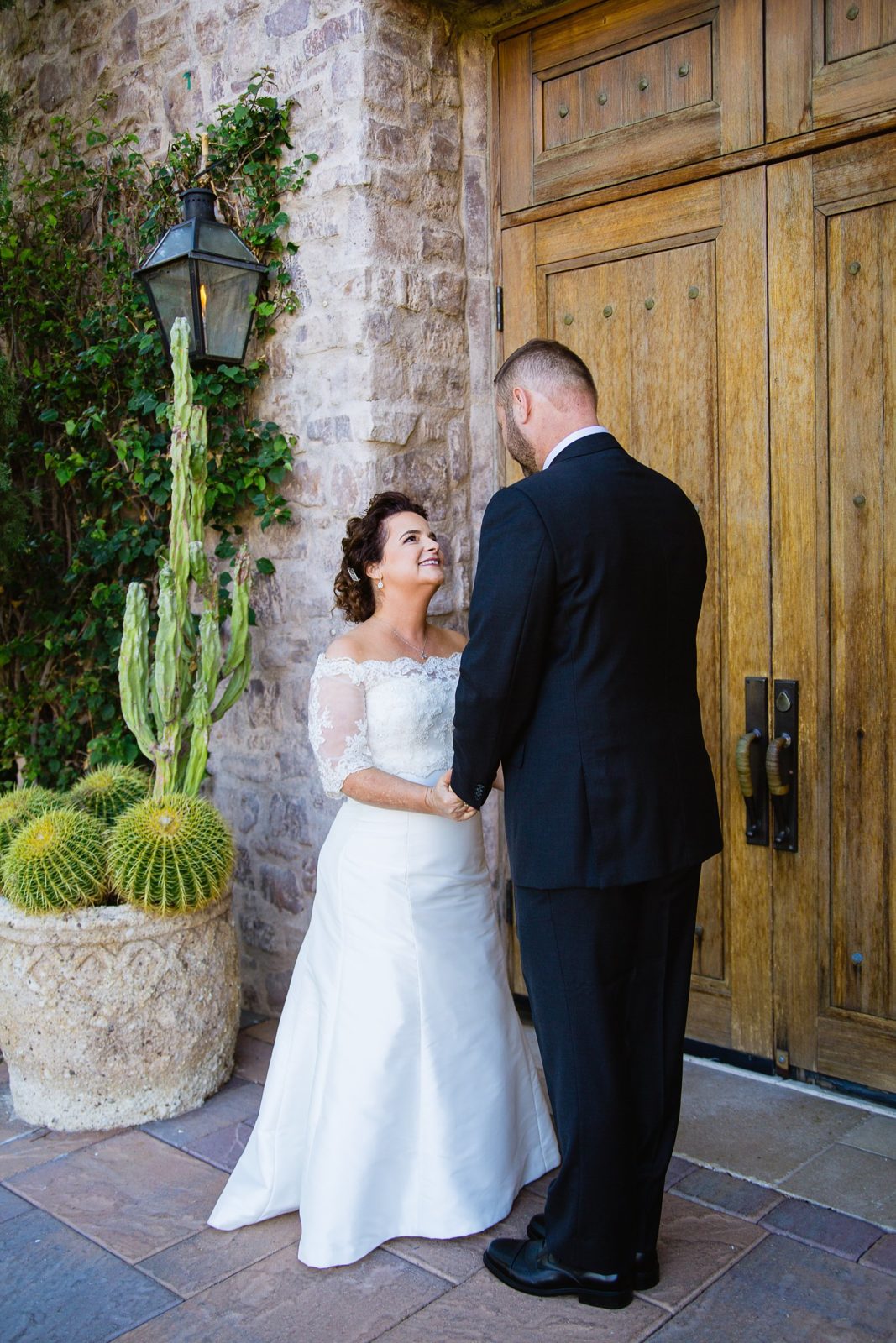 Bride and groom share an intimate moment during their Superstition Mountain Clubhouse wedding by Mesa wedding photographer PMA Photography.