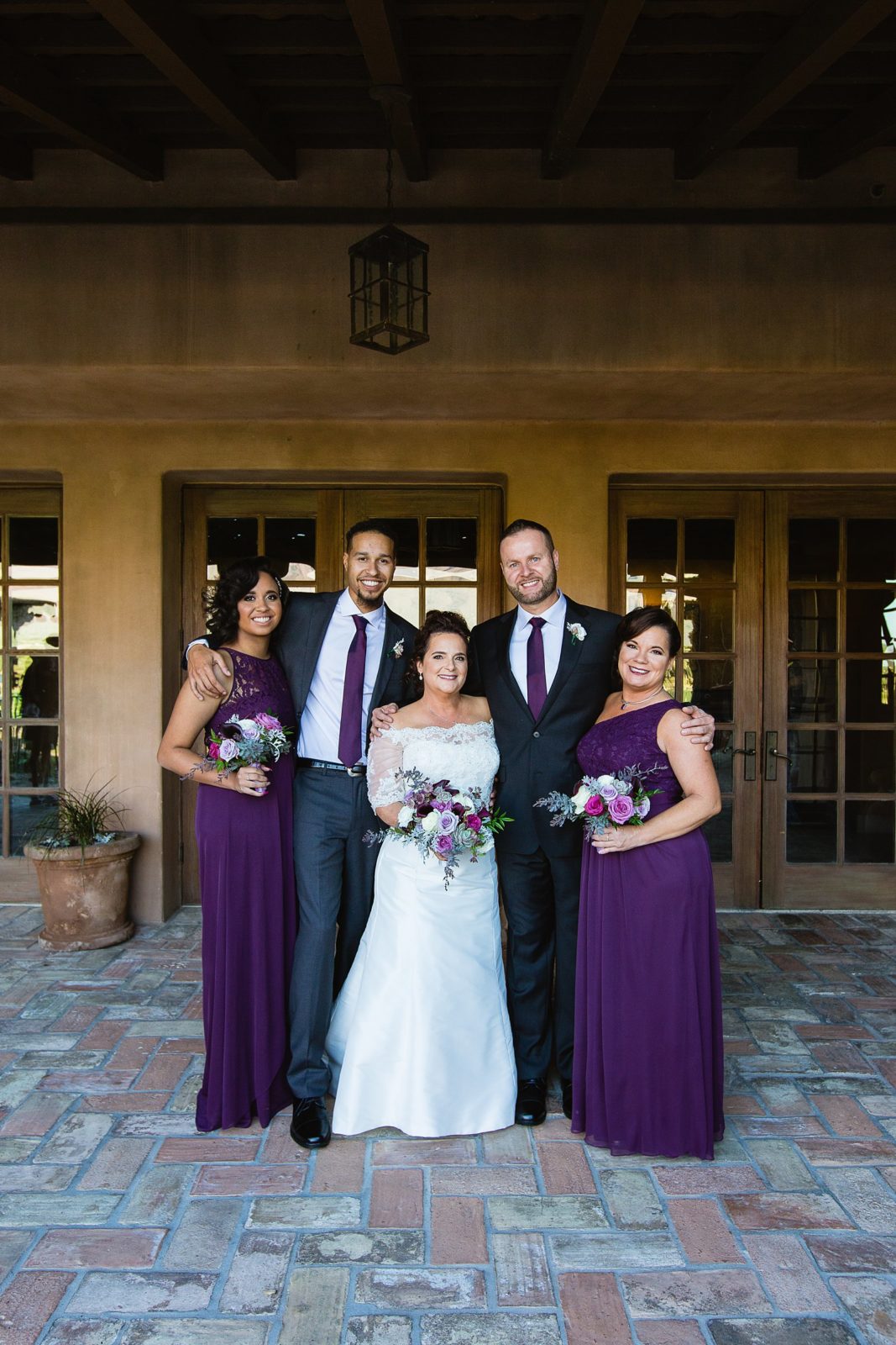 Bridal party together at a Superstition Mountain Clubhouse wedding by Arizona wedding photographer PMA Photography.