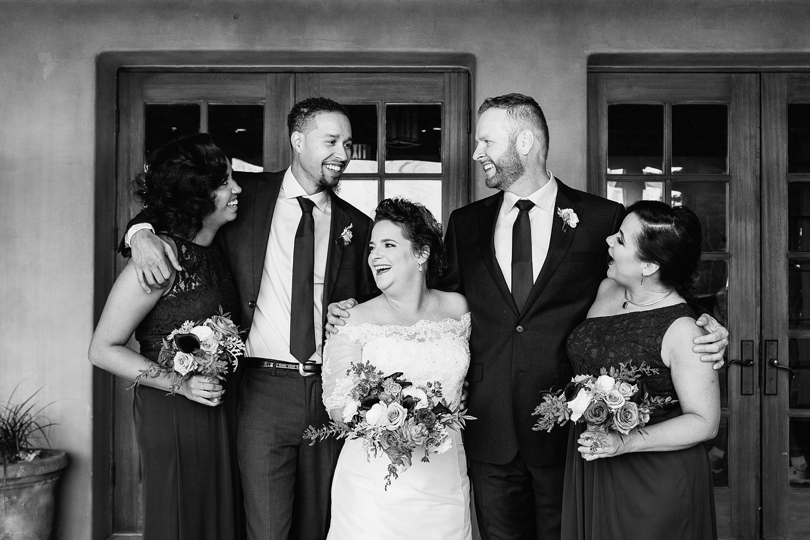 Bridal party laughing together at Superstition Mountain Clubhouse wedding by Mesa wedding photographer PMA Photography.