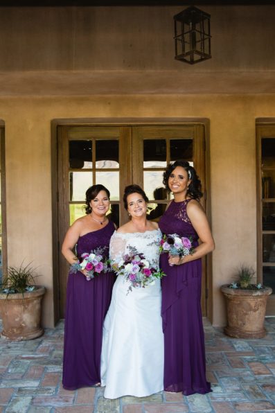 Bride and bridesmaids together at a Superstition Mountain Clubhouse wedding by Arizona wedding photographer PMA Photography.