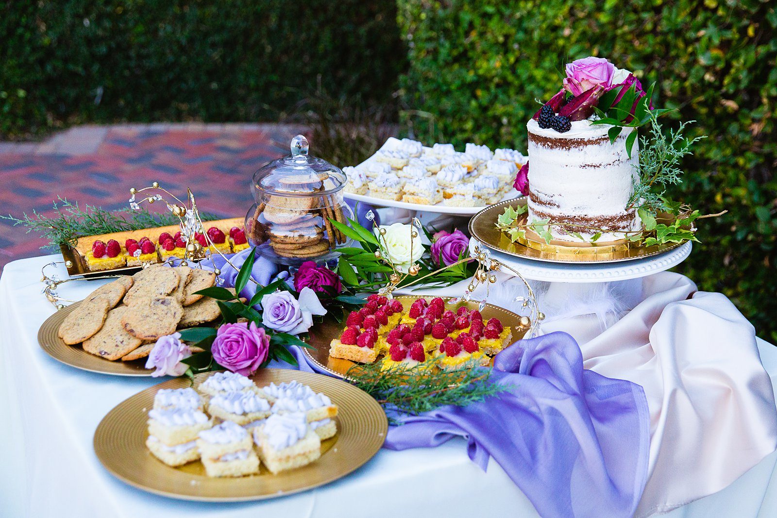Purple desert table at Superstition Mountain Clubhouse wedding reception by Arizona wedding photographer PMA Photography.