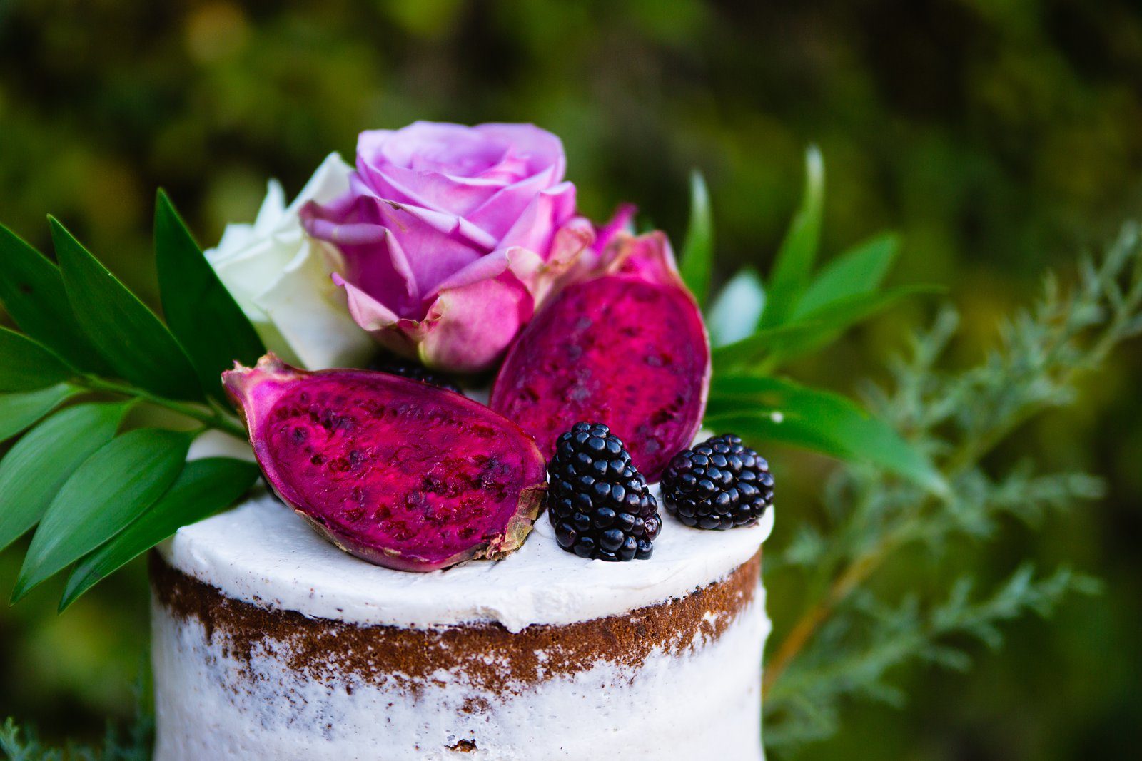 Prickly pear and blackberry wedding cake by Arizona wedding photographer PMA Photography.