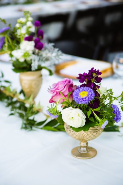 Wedding reception purple and gold table decor at Superstition Mountain Clubhouse by Arizona wedding photographer PMA Photography.