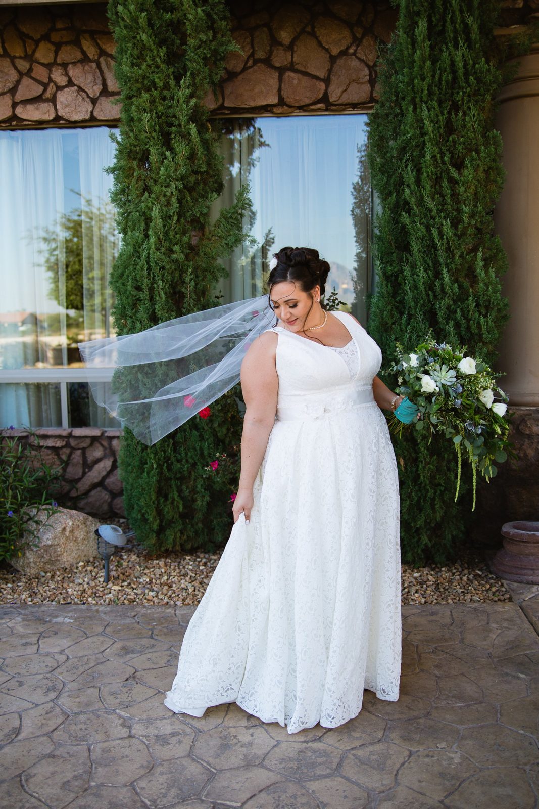 Bride's simple lace garden inspired wedding dress for her Superstition Manor wedding by PMA Photography.