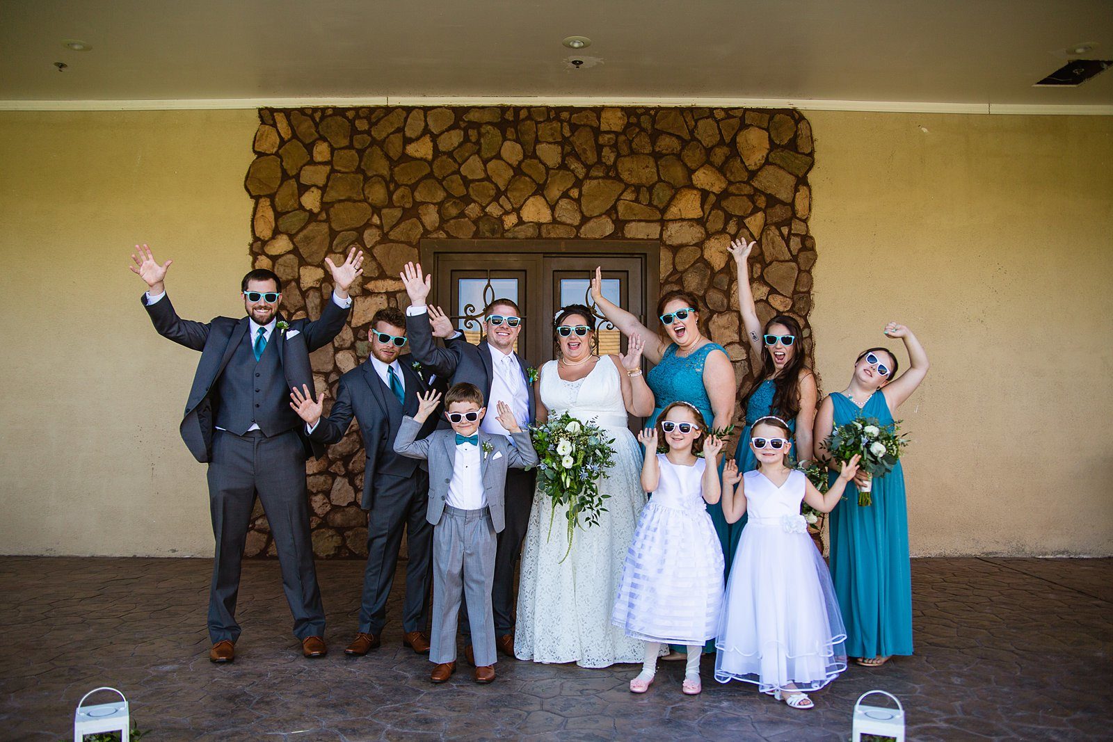 Bridal party having fun together at Superstition Manor weding by Arizona wedding photographer PMA Photography.
