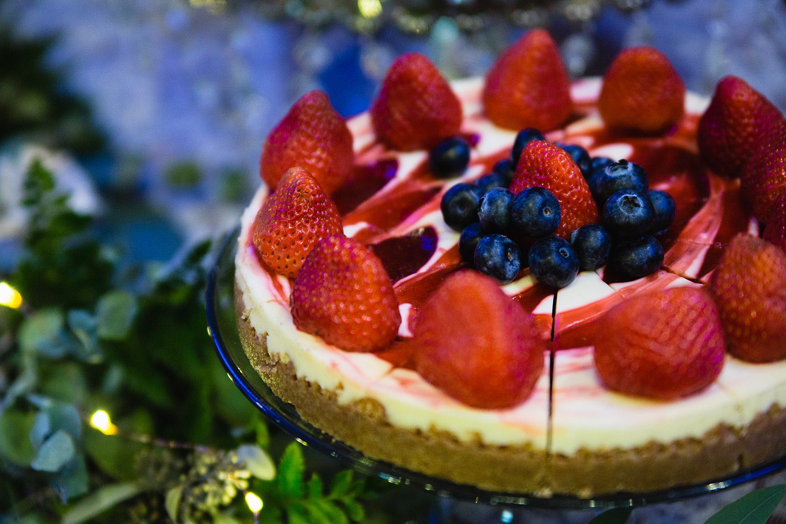Wedding cheesecake wedding cake alternative with fresh strawberries and blueberries by PMA Photography.