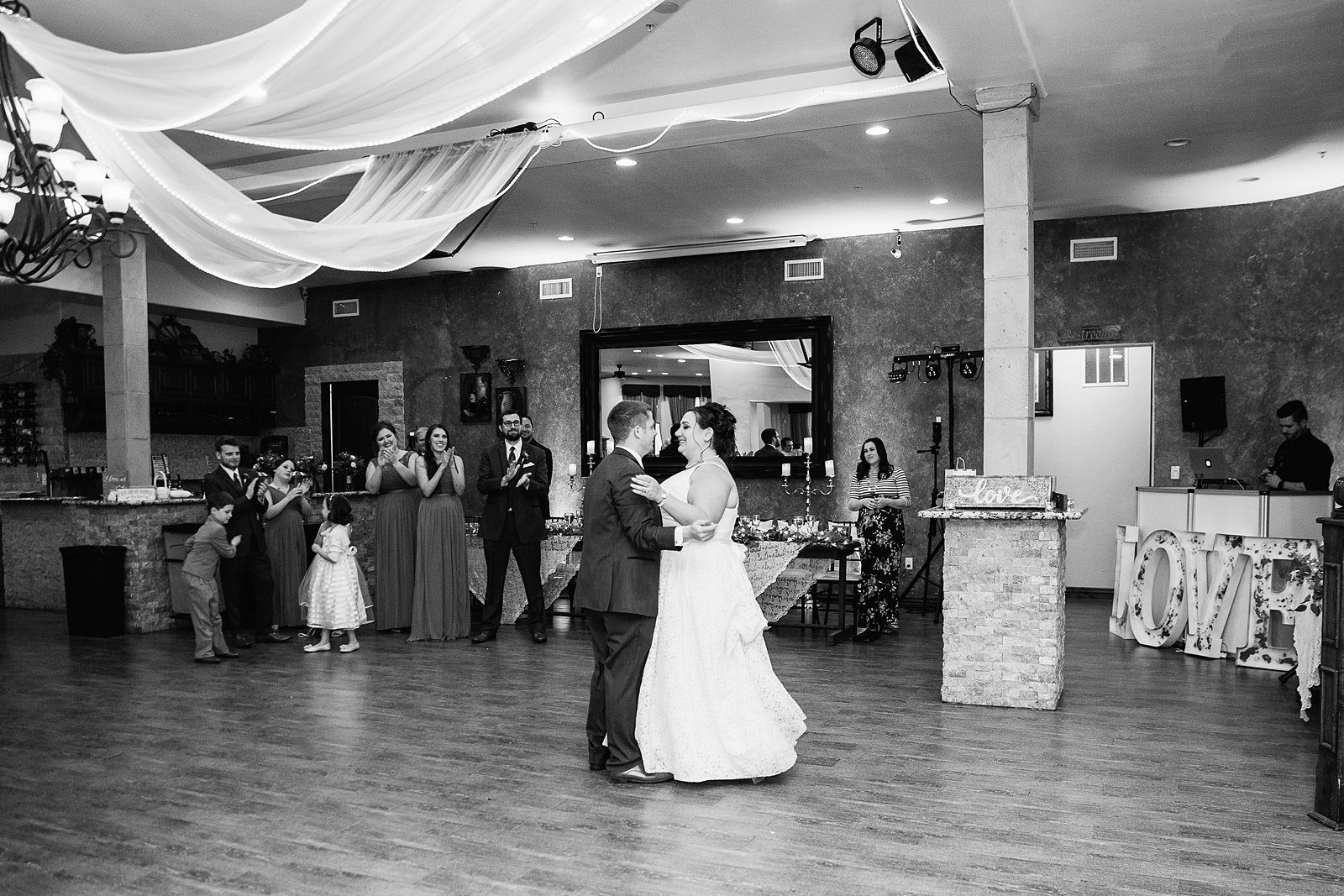 Bride and Groom sharing first dance at their Supserstition Manor wedding reception by Arizona wedding photographer PMA Photography.
