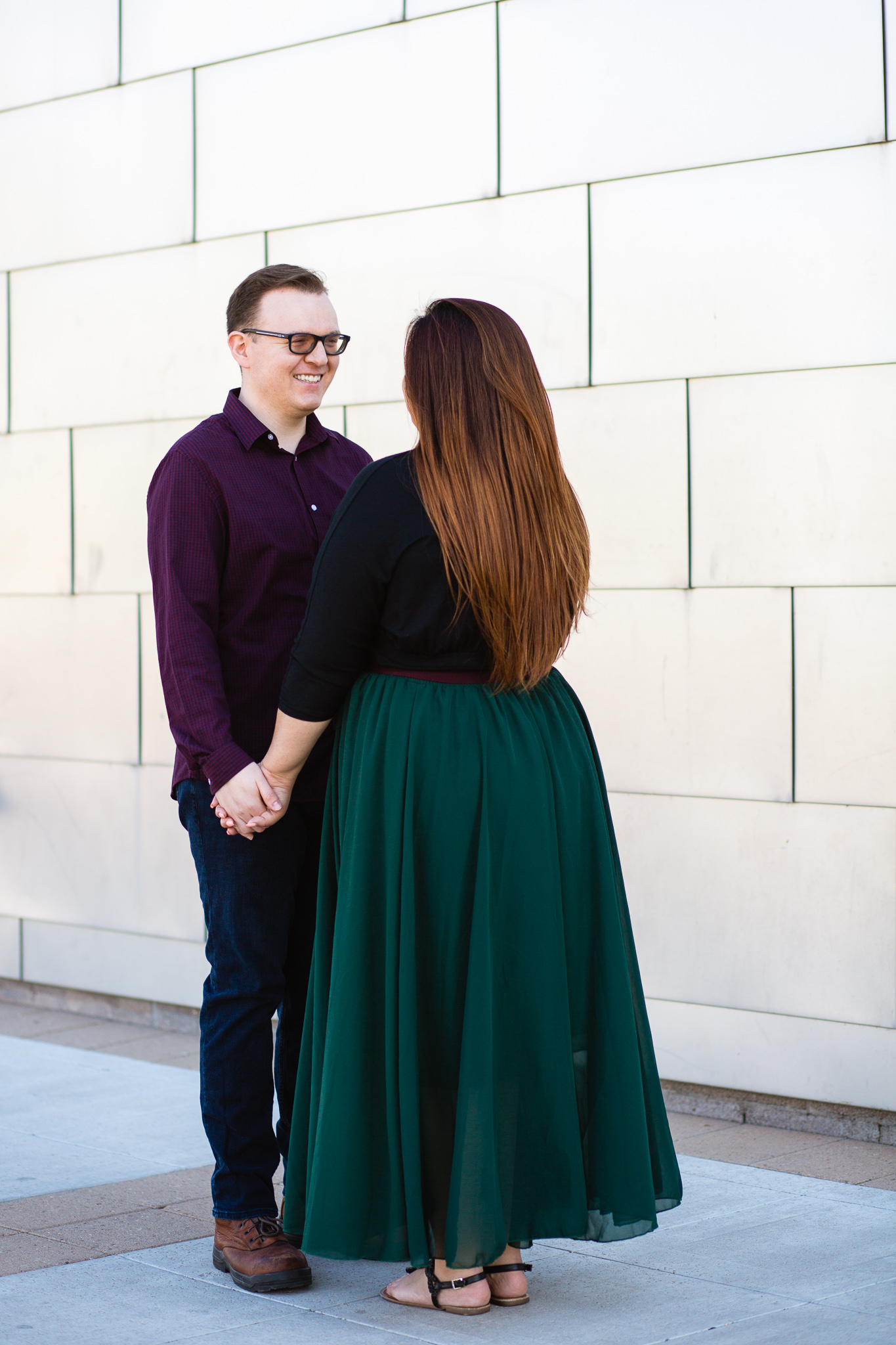Couple pose during their Mesa engagement session by Arizona wedding photographer PMA Photography.
