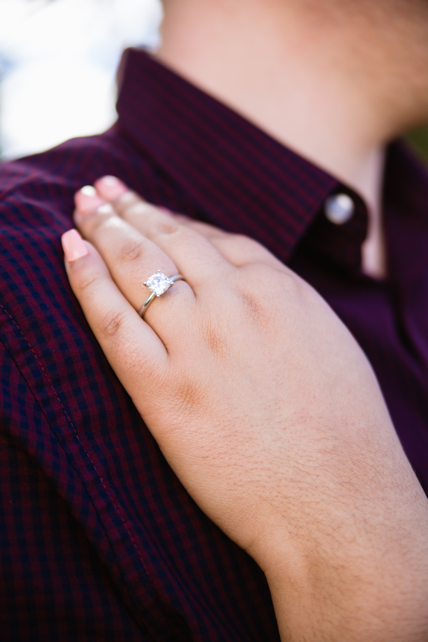 Detail image of an engagement ring at an engagement session by PMA Photography.