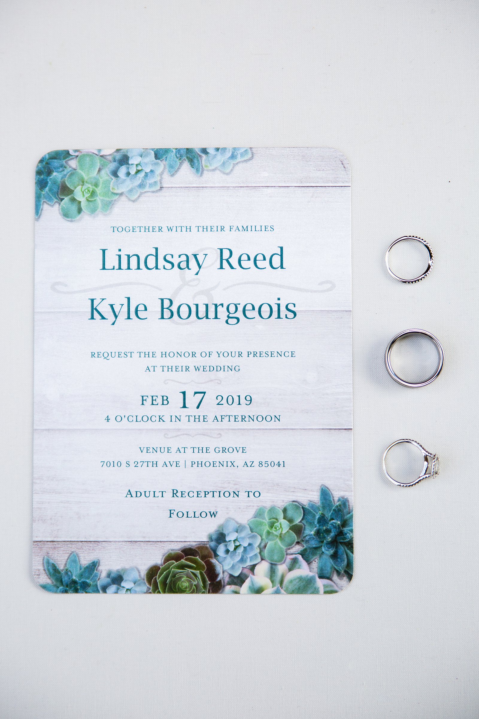 Rustic succulent wedding invitations with wedding rings by PMA Photography.