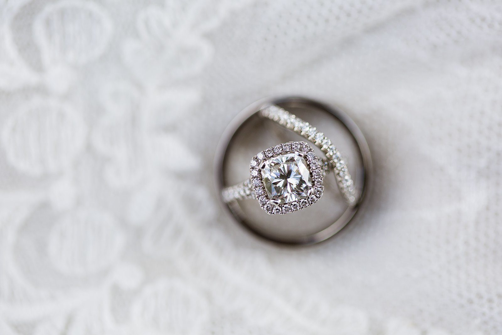 Square engagement ring and matching wedding band close up detail image by PMA Photography.