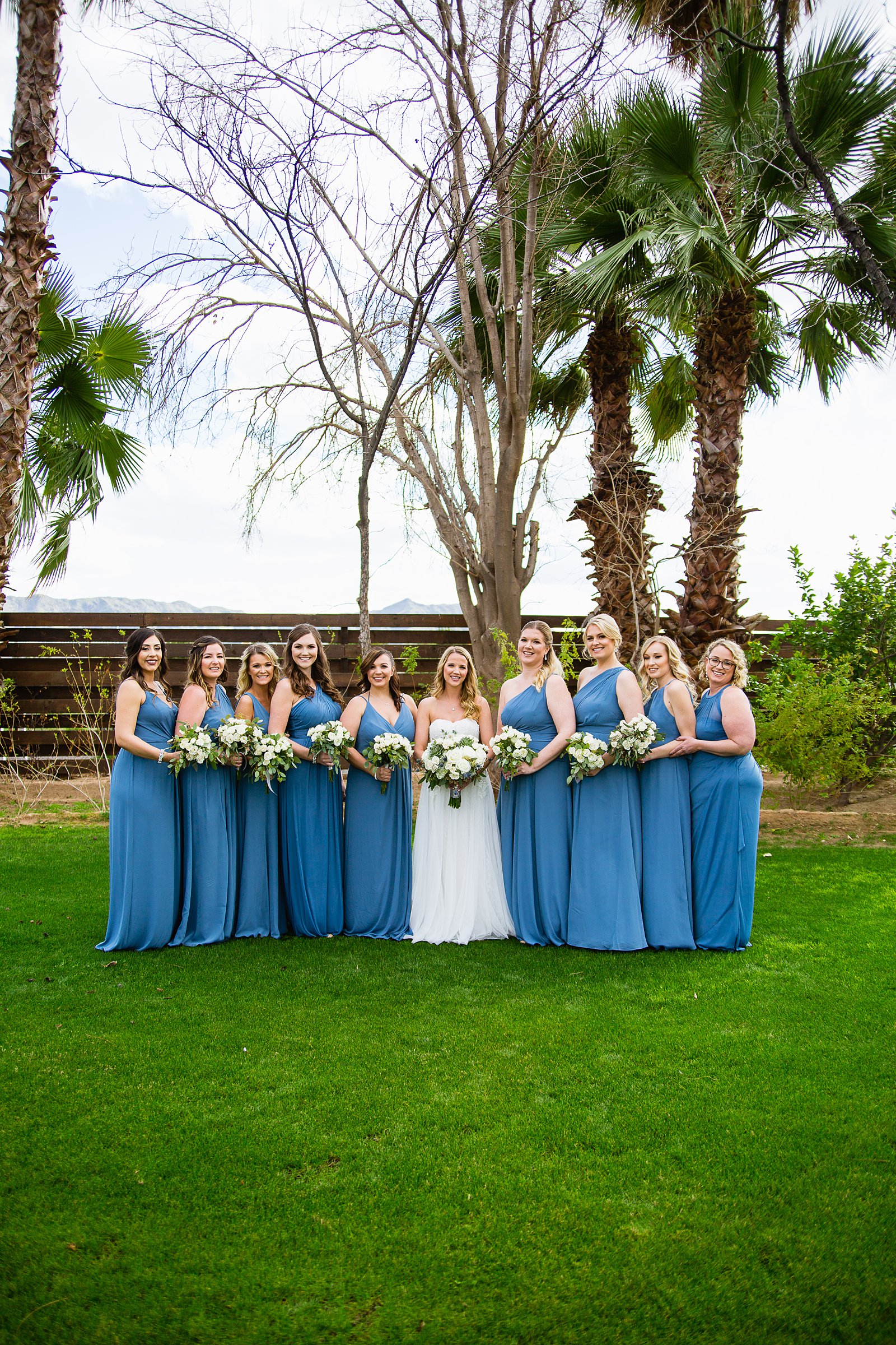 Bride and bridesmaids together at a Venue At The Grove wedding by Arizona wedding photographer PMA Photography.