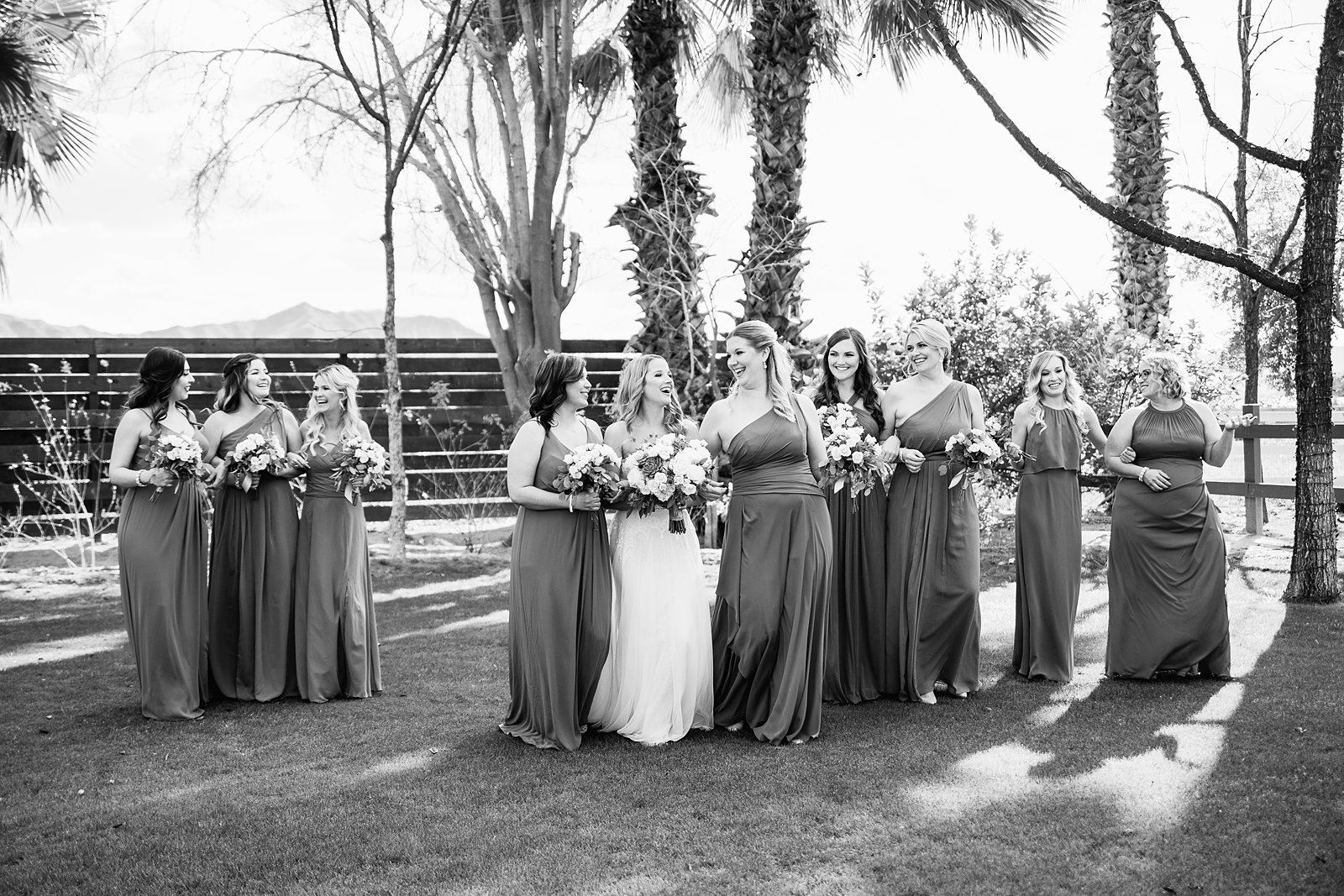 Bride and bridesmaids together at a Venue At The Grove wedding by Arizona wedding photographer PMA Photography.