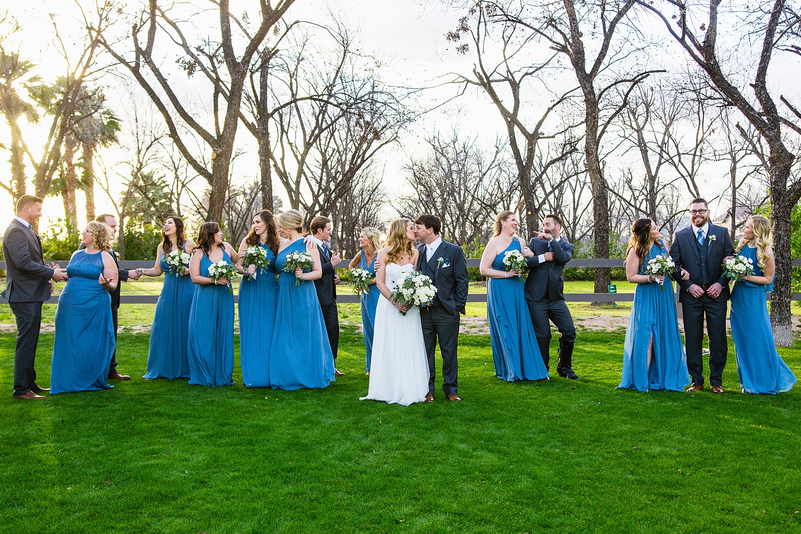Bridal party having fun together at Venue At The Grove weding by Arizona wedding photographer PMA Photography.
