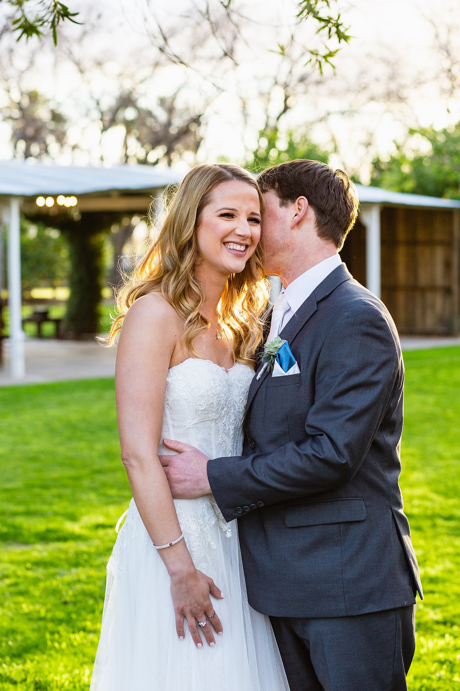 Bride and Groom laughing together during their Venue At The Grove wedding by Arizona wedding photographer PMA Photography.