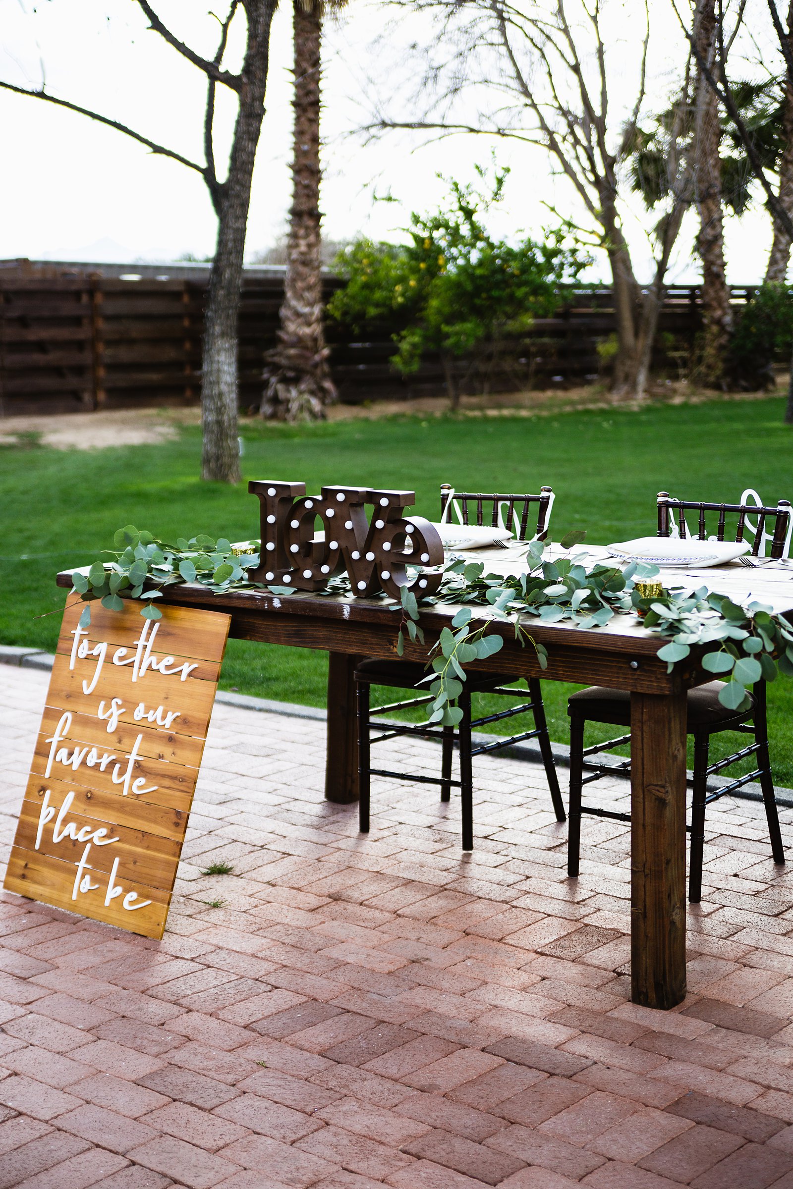 Sweetheart table at Venue At The Grove wedding reception by Arizona wedding photographer PMA Photography.