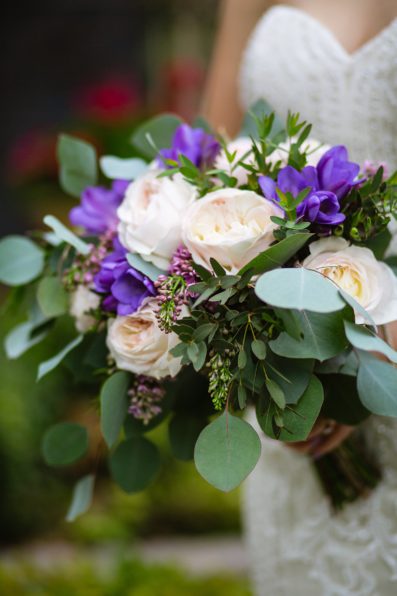 Bride's elegant cream and purple garden bouquet by PMA Photography.