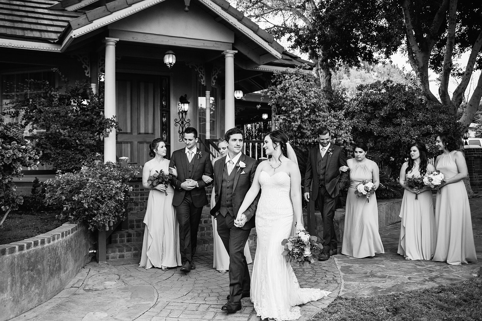Mixed gender bridal party walking together at The Wright House wedding by Mesa wedding photographer PMA Photography.