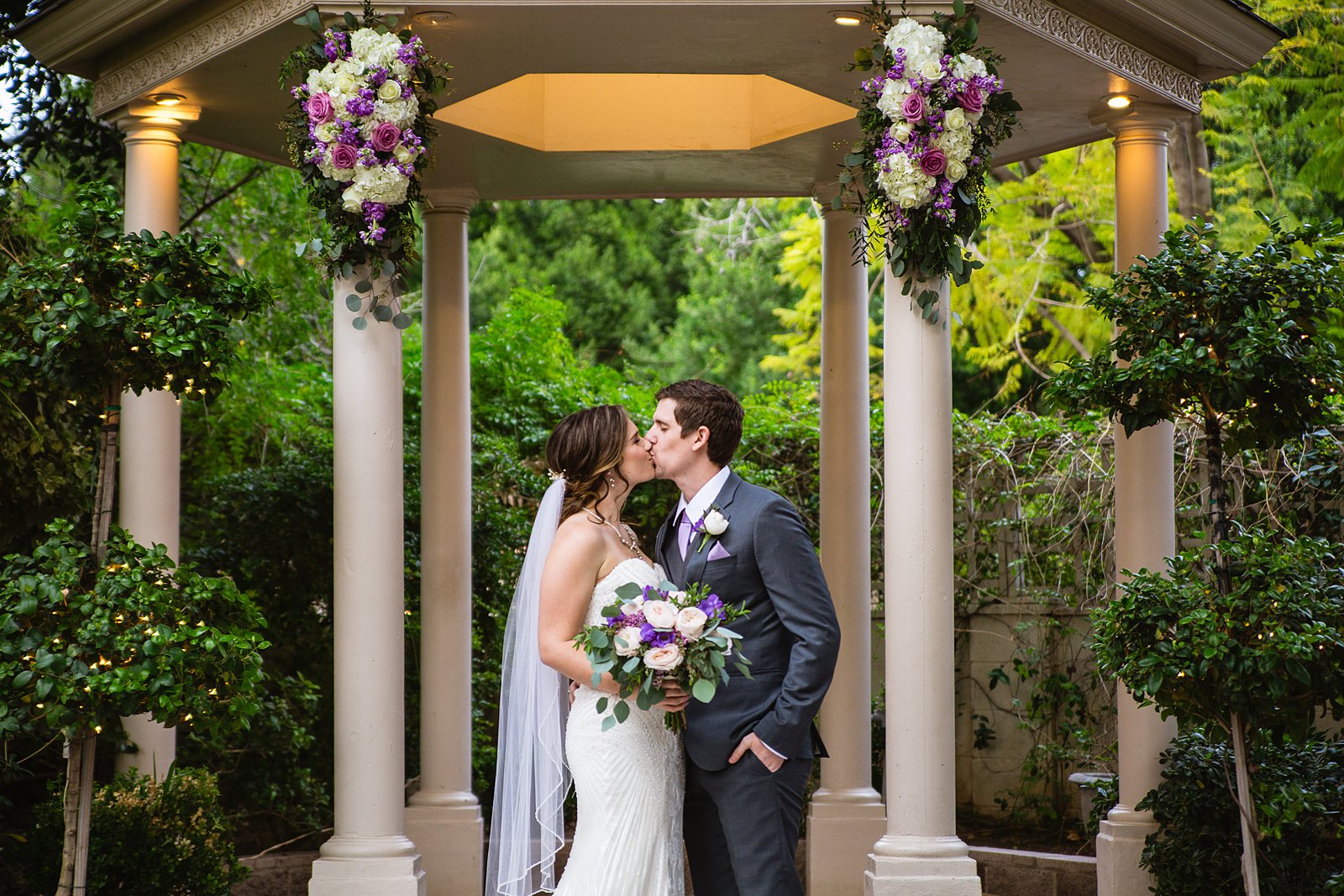 Bride and Groom share a kiss during their The Wright House wedding by Arizona wedding photographer PMA Photography.