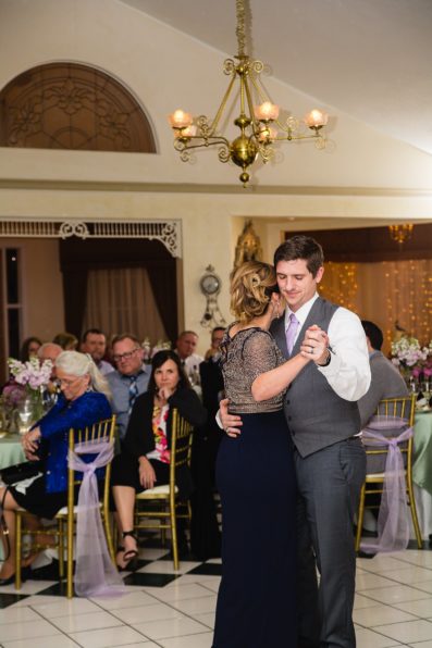 Mother son dance at their The Wright House wedding reception by Arizona wedding photographer PMA Photography.