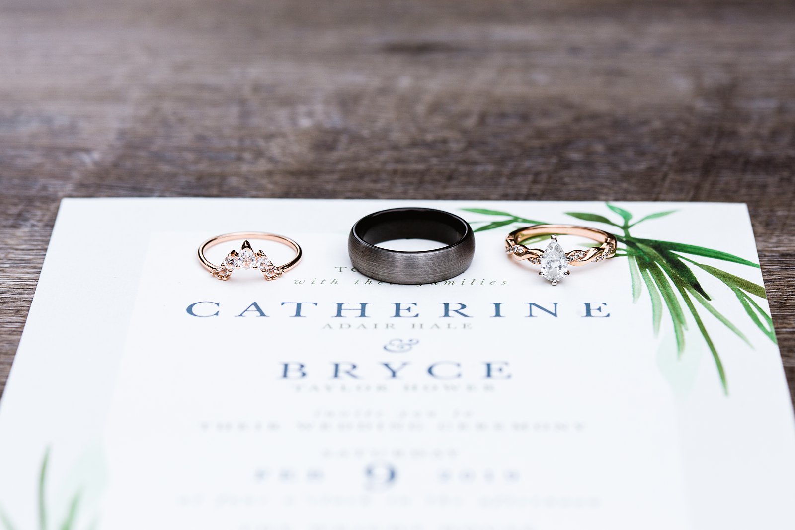 Unique engagement ring and wedding bands on the couples garden invitations by PMA Photography.