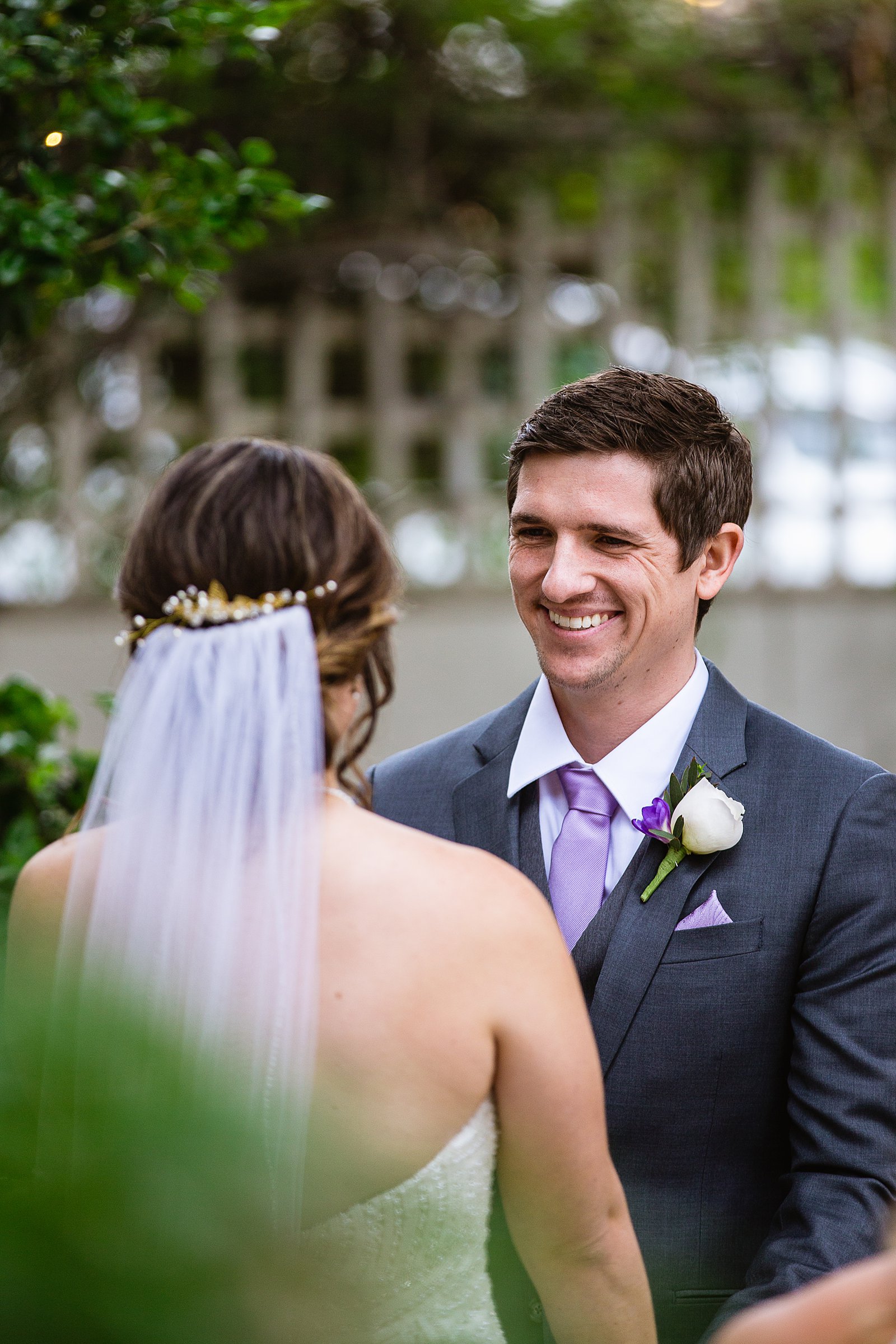 Groom looking at his bride during their wedding ceremony at The Wright House by Mesa wedding photographer PMA Photography.
