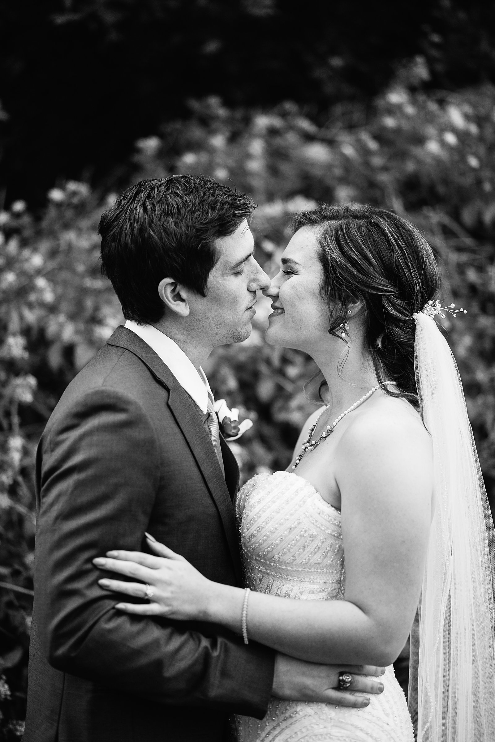 Bride and Groom share a kiss during their The Wright House wedding by Mesa wedding photographer PMA Photography.