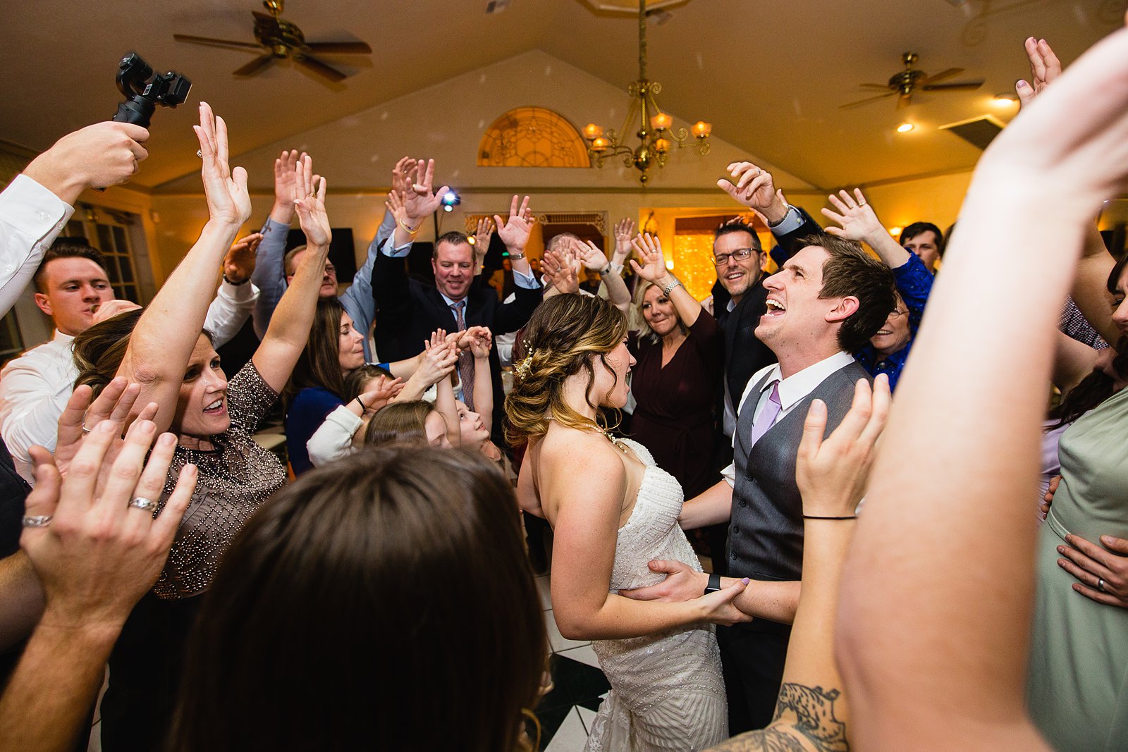 Bride dancing with guests at The Wright House wedding reception by Mesa wedding photographer PMA Photography