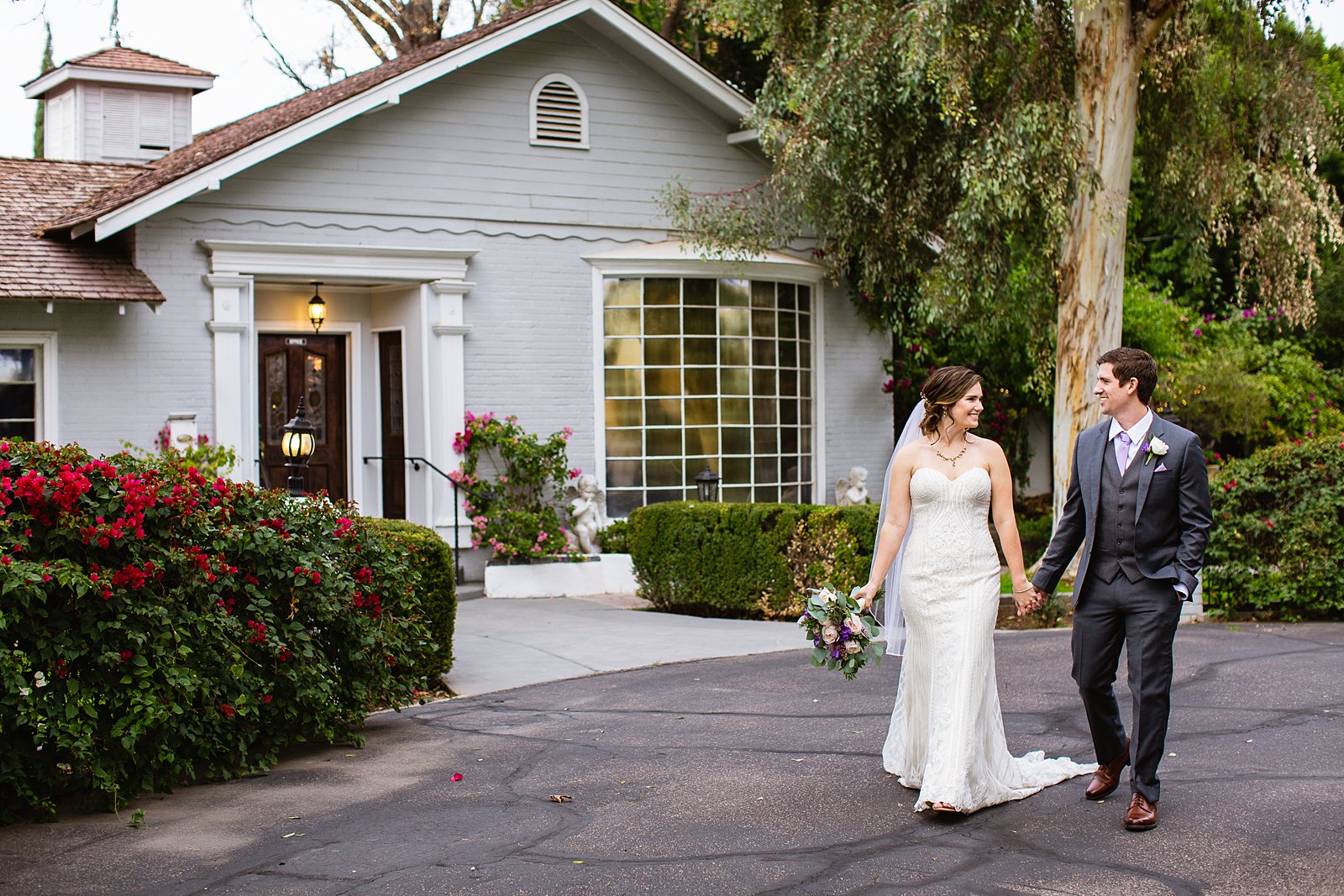 Bride and Groom walking together during their The Wright House wedding by Mesa wedding photographer PMA Photography.