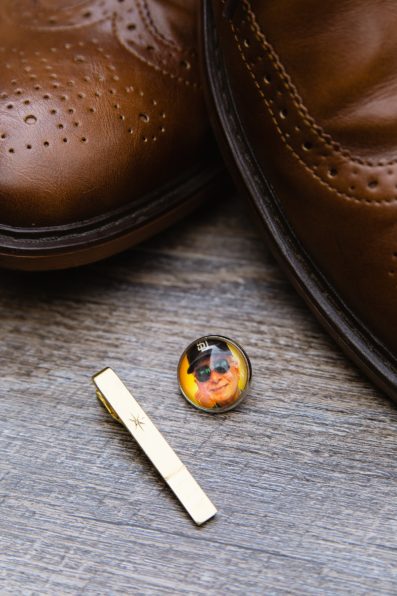 Groom's father's tie clip and pin of his father to remember him on his wedding day by PMA Photography.