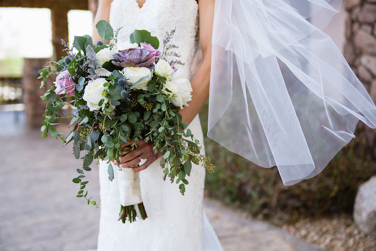 Bride's romantic white and purple succulent bouquet by Arizona wedding photographer PMA Photography.