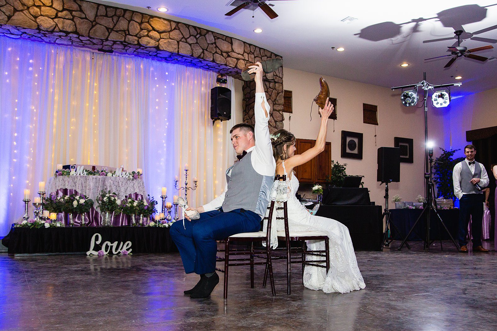 Bride and Groom play newlywed game durring wedding reception at Superstition Manor by Arizona wedding photographer PMA Photography.