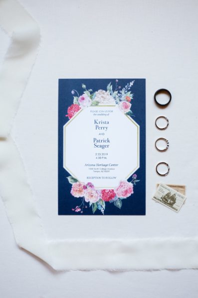 Navy floral wedding invitation with wedding rings by PMA Photography.