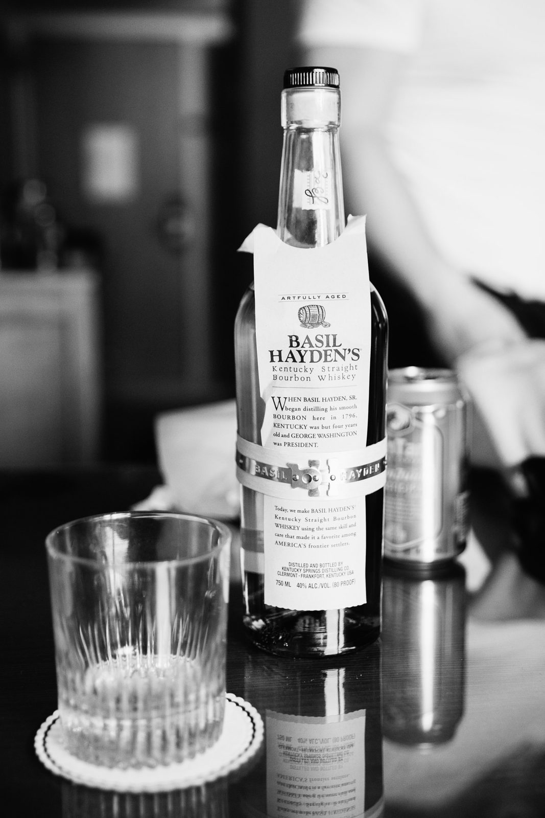 Basil Hayden's bourbon whiskey in the groom's getting ready room by PMA Photography.