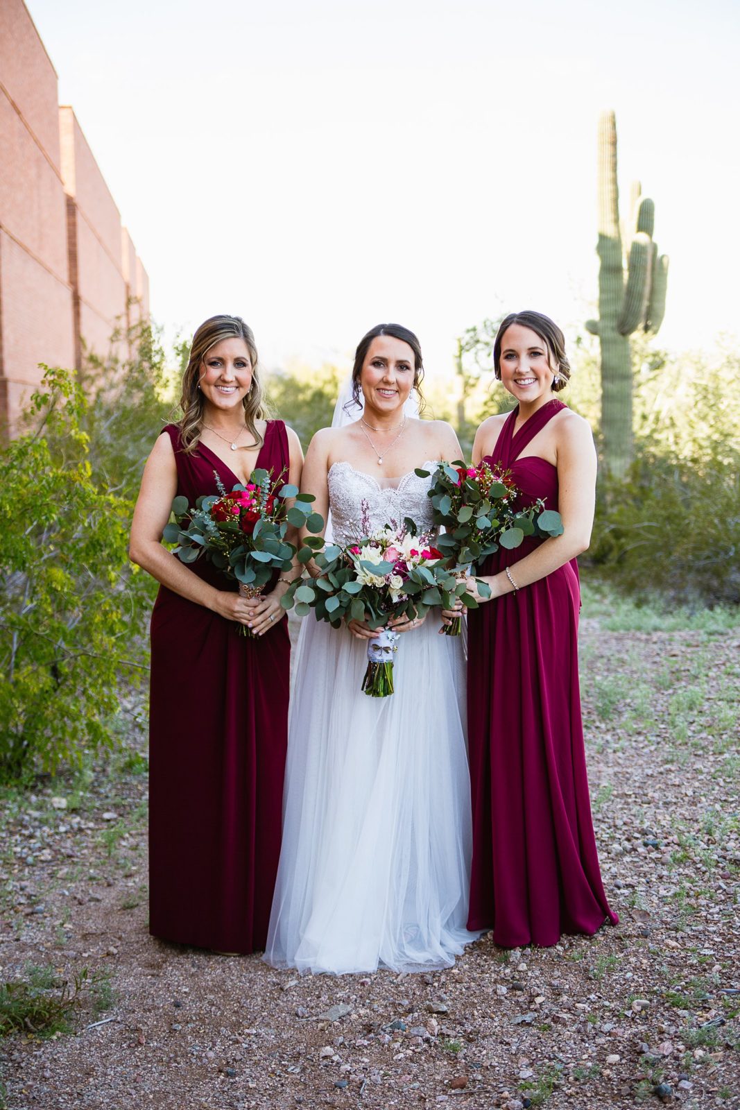 Bride and bridesmaids together at a Arizona Heritage Center at Papago Park wedding by Arizona wedding photographer PMA Photography.